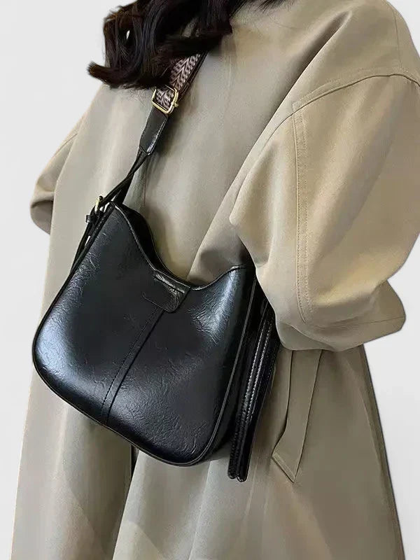 Sac à bandoulière pour femme, accessoire mode essentiel pour organiser vos essentiels quotidiens avec style.