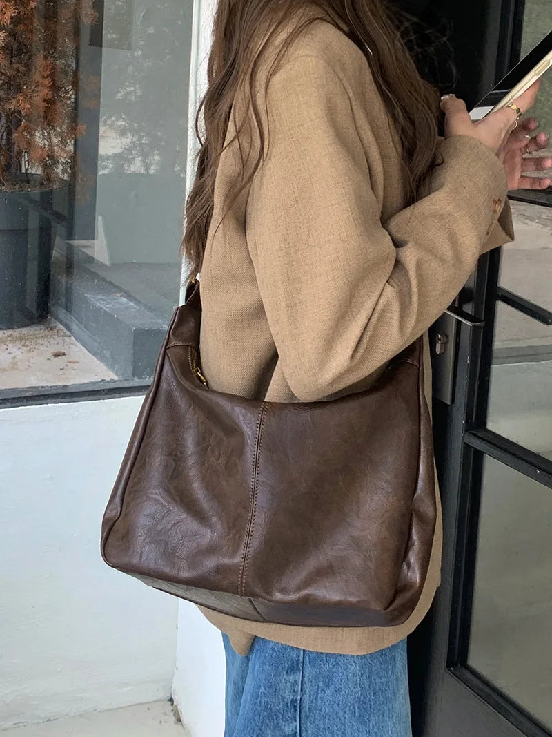 Sac à main bandoulière femme similicuir. Compartiments pratiques, idéal pour le quotidien. Sac mode, tendance.