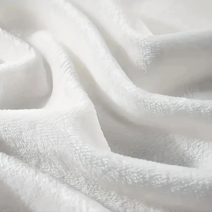 Couverture en flanelle léopard pour chambre ou salon. Polaire chaude et douce, confort hivernal et style animal.