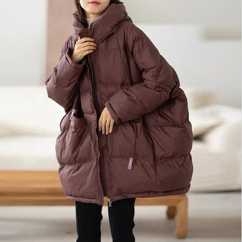 Manteau doudoune femme oversize élégant, parfait pour rester au chaud avec style cet hiver. Mode féminine.