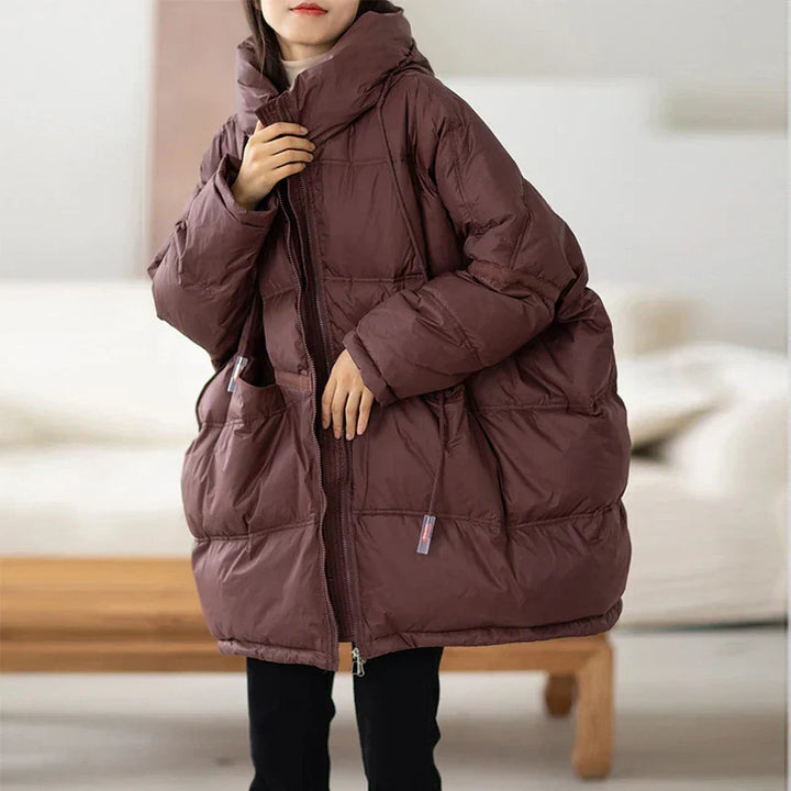 Manteau doudoune femme oversize élégant, parfait pour rester au chaud avec style cet hiver. Mode féminine.