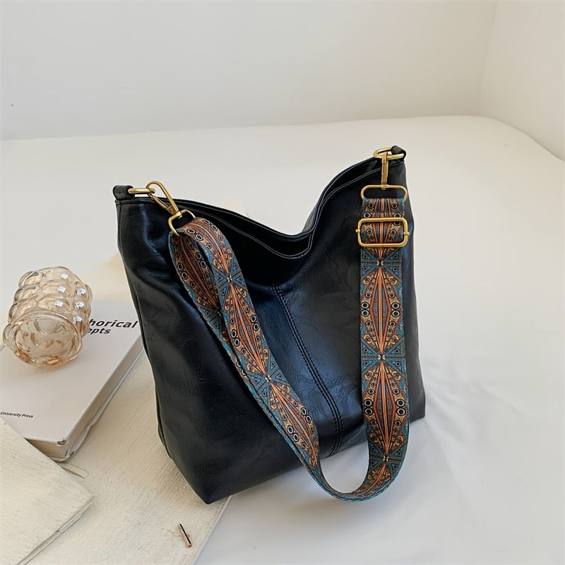 Sac bandoulière vegan pour femme, aspect vintage, élégant et pratique pour un look quotidien.