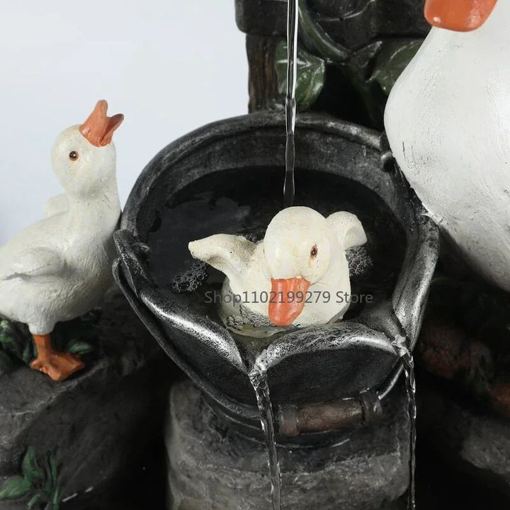 Figurine fontaine solaire LED pour jardin zen, canard et écureuil, crée une ambiance relaxante.