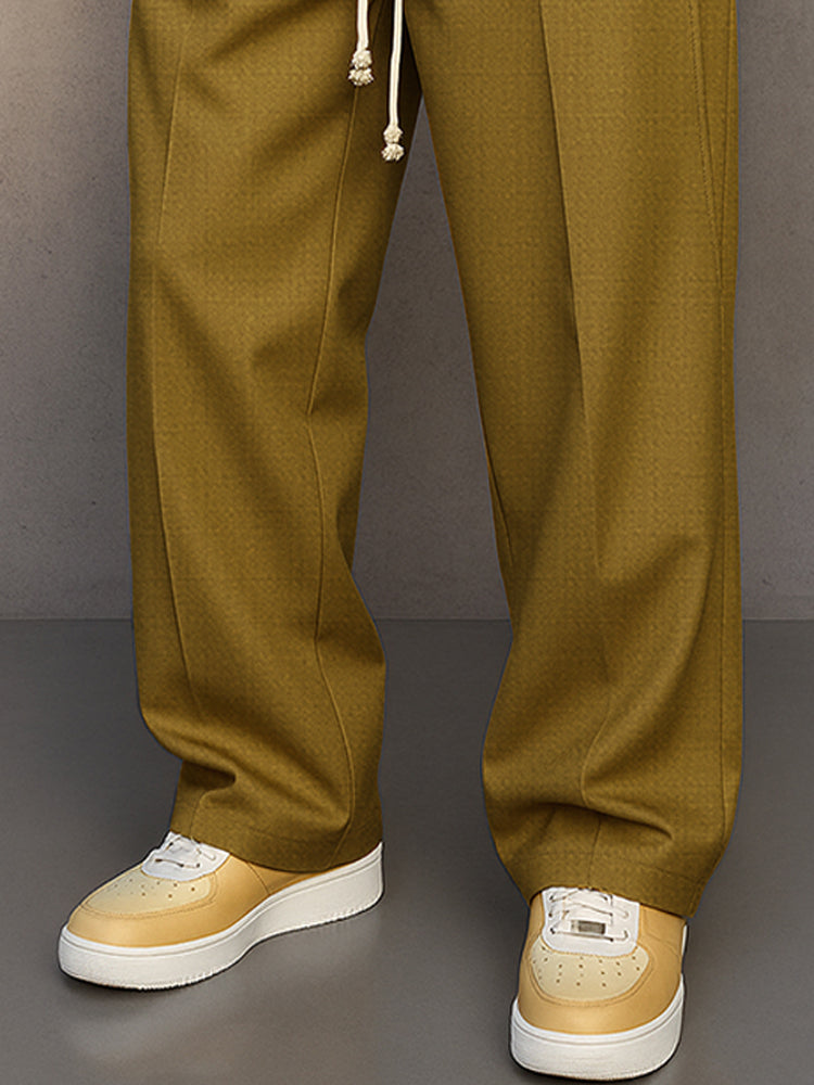 Pantalon homme décontracté noir, coupe ample et fluide, cordon et taille élastique pour un confort maximal.