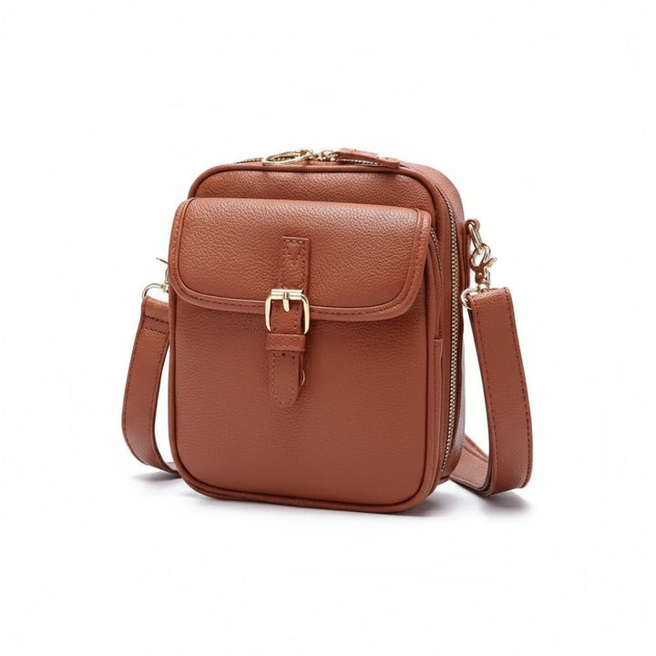 Sac anti-vol DAYGUARD marron avec compartiments sécurisés, parfait pour voyages et vie urbaine. Organisation optimale.