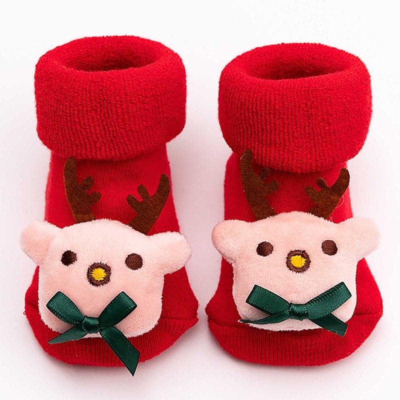 Chaussons bébé chauds antidérapants pour Noël, conçus pour les pieds des bébés filles et garçons.