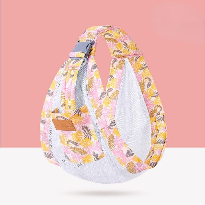 Parent actif avec écharpe de portage ergonomique, offrant mains-libres et confort respirant pour le bébé.