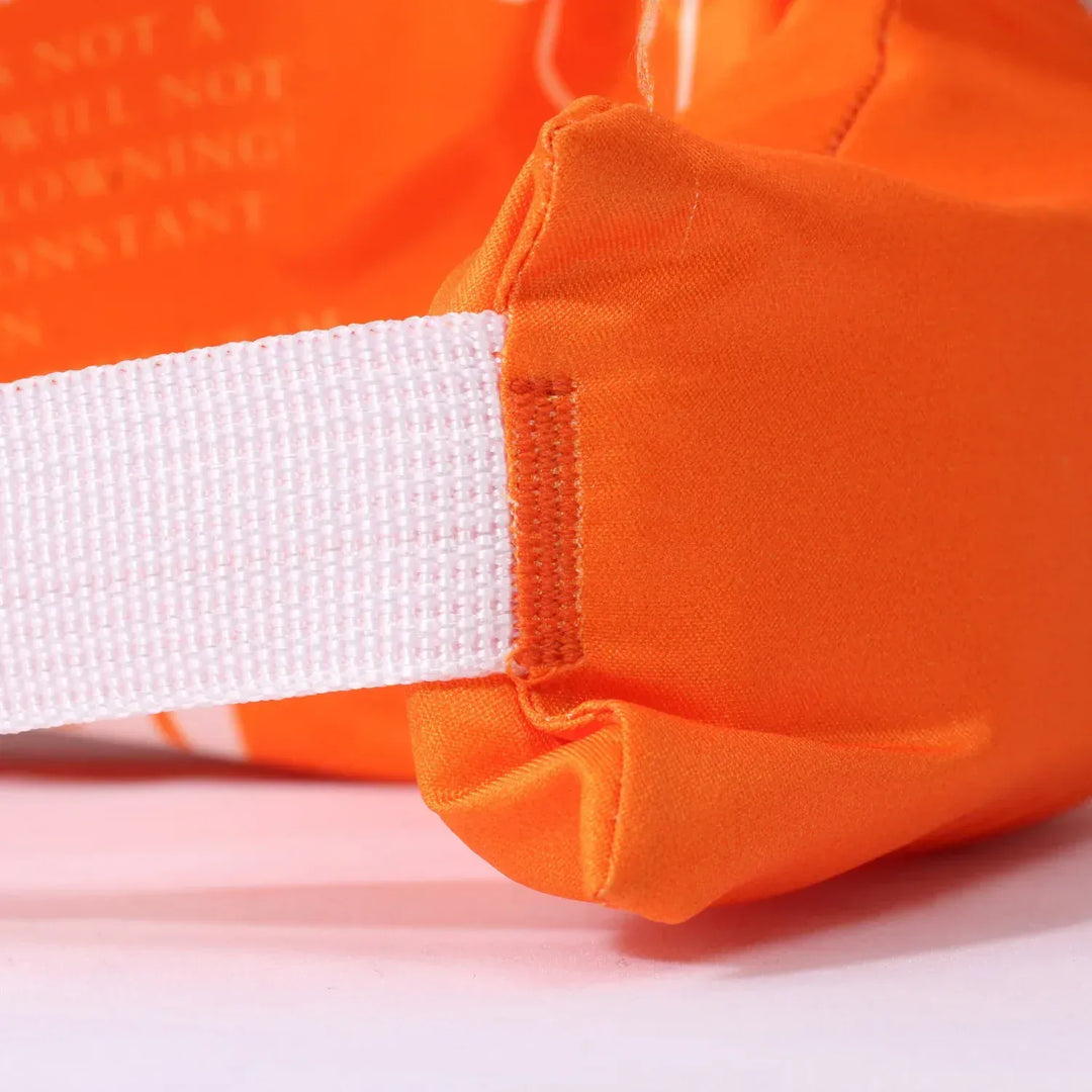 Gilet flottant confortable pour enfant, avec brassards de sécurité, pour un apprentissage serein de la natation.