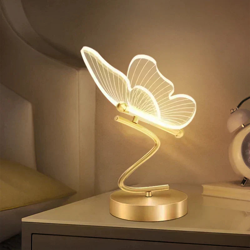 Lampe de table LED élégante design papillon. Lumière tricolore pour une ambiance moderne et chic.
