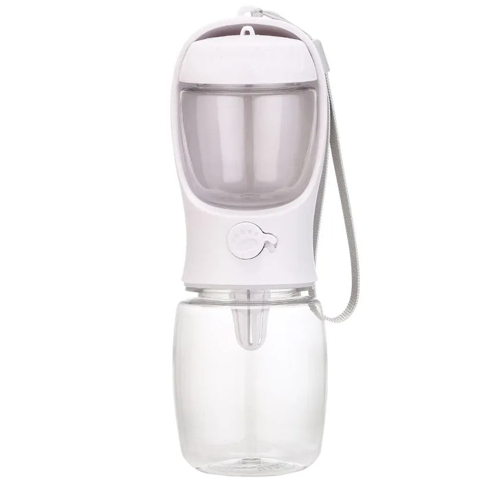 Bouteille d'eau compacte avec distributeur de friandises intégré pour animaux. Essentielle pour les sorties et voyages.