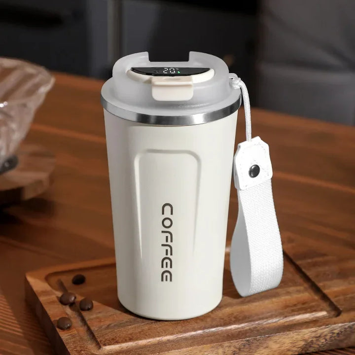 Tasse thermos isotherme, design épuré, pour boissons chaudes au bureau ou en déplacement.