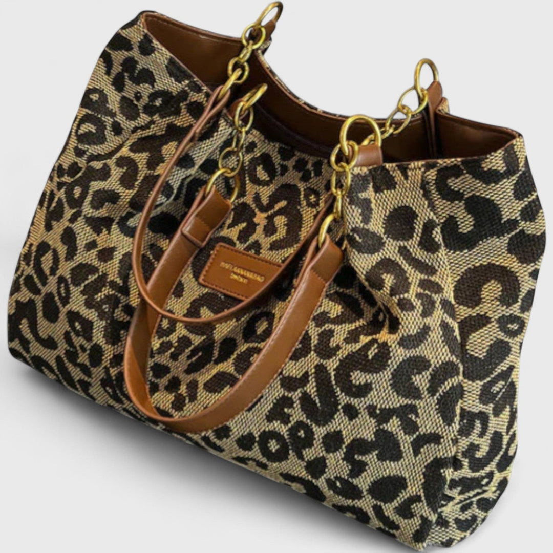 Grand sac shopping femme polyvalent en toile léopard, pratique pour le quotidien avec bandoulière.