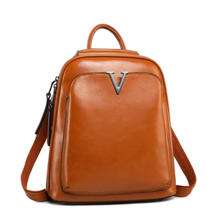 Sac à dos Alba pour femme en cuir verni, design tendance et compact pour une organisation quotidienne stylée.