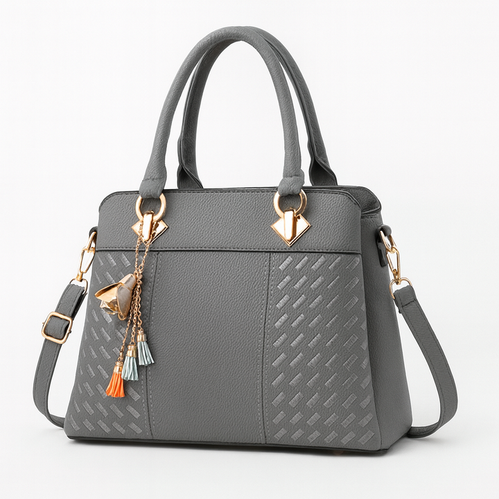 Accessoire de mode: sac bandoulière femme, cuir souple, couleur intemporelle, pour un style chic.