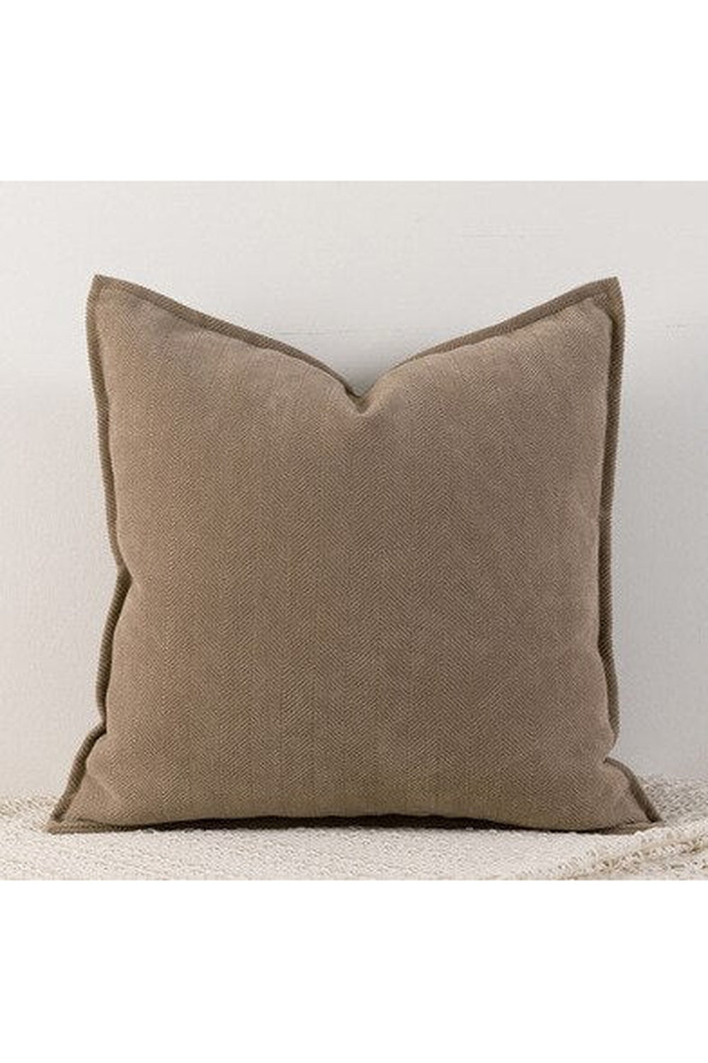 Housse de coussin élégante pour salon chic et confortable, design intemporel.