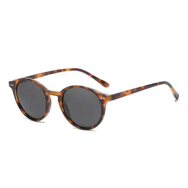 Lunettes de soleil rondes polarisées rétro UV400. Accessoire de mode unisexe idéal pour l'été.