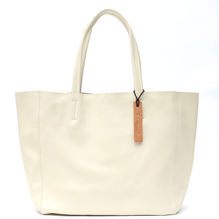 Vue latérale du sac cabas en cuir femme, montrant sa capacité et sa forme élégante.