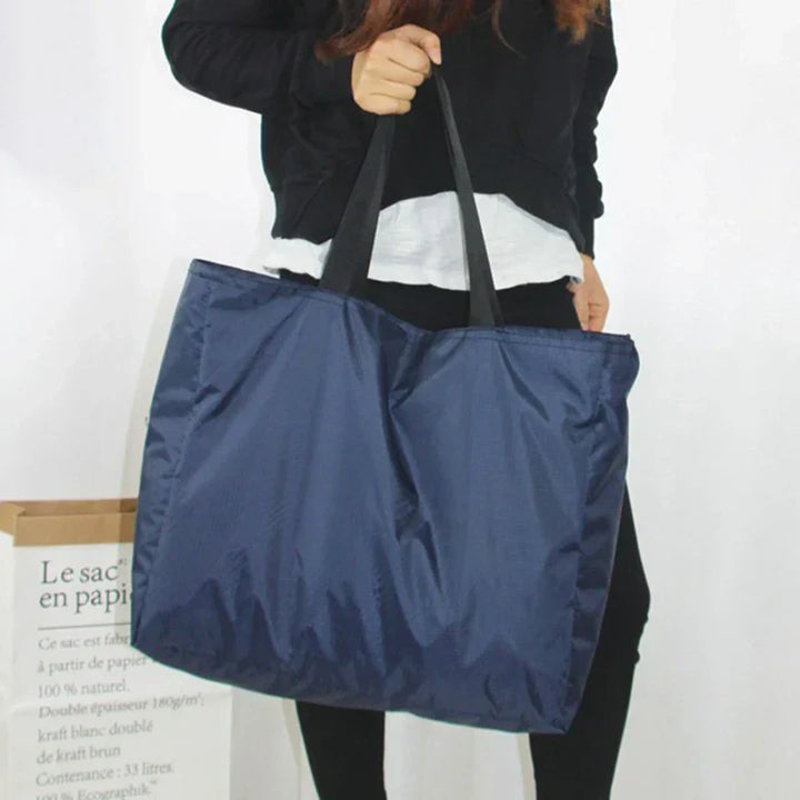 Bagage de voyage imperméable et résistant pour femmes, pliable et léger, conçu pour les week-ends ou comme sac de sport.
