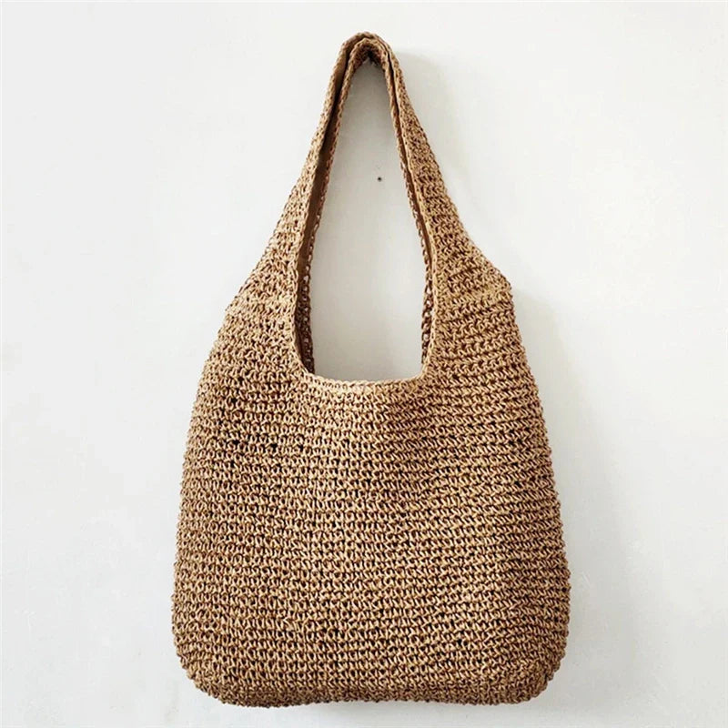 Sac de plage Atria chic en paille pour femme, idéal pour l'été et les vacances.