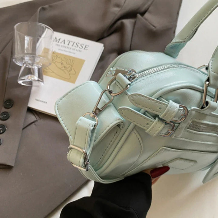 Sac bandoulière Alméa pratique et compact, idéal pour ranger l'essentiel avec un style épuré.