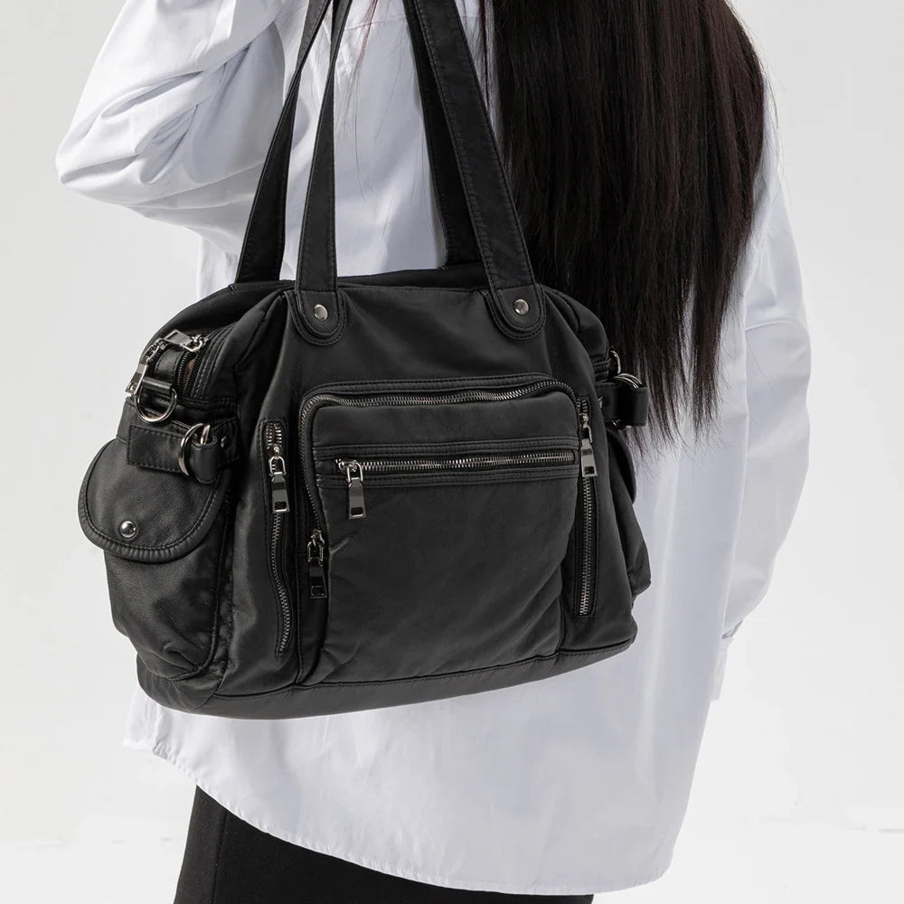 Sac à main élégant femme noir, parfait pour les cours, avec bandoulière et intérieur bien organisé.