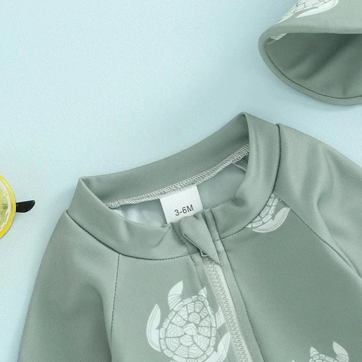 Ensemble maillot de bain garçons manches longues avec bonnet de bain, motif tortue et dinosaure. Protection UV bébé.