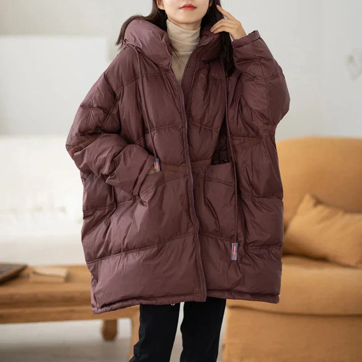 Doudoune femme hivernale matelassée, coupe oversize. Chaude et confortable pour affronter le froid avec style.