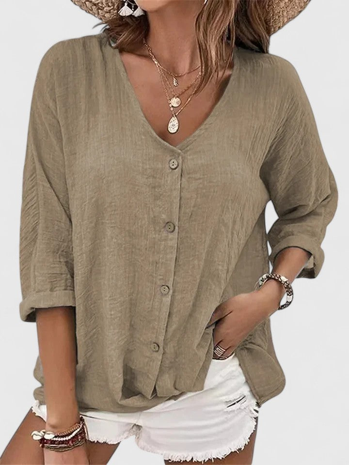 Blouse estivale femme élégante, coupe décontractée chic, parfaite pour les jours ensoleillés. Légère et respirante.