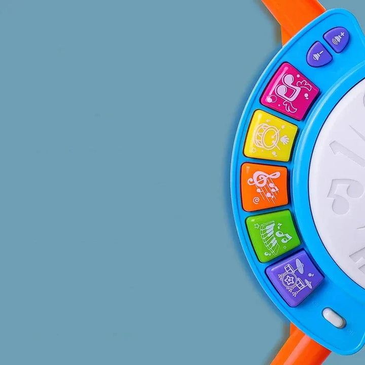 Batterie enfant avec micro, lumières et sons. Jouet interactif stimulant l'éveil musical, la motricité et la coordination.