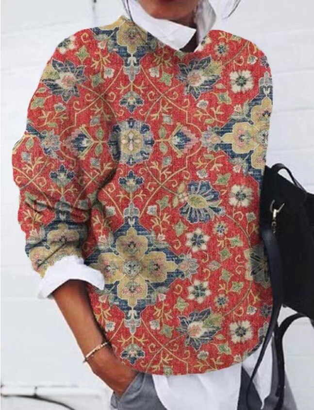 Pull femme tendance pour un look décontracté en hiver, avec un motif floral et animalier unique et chaud.