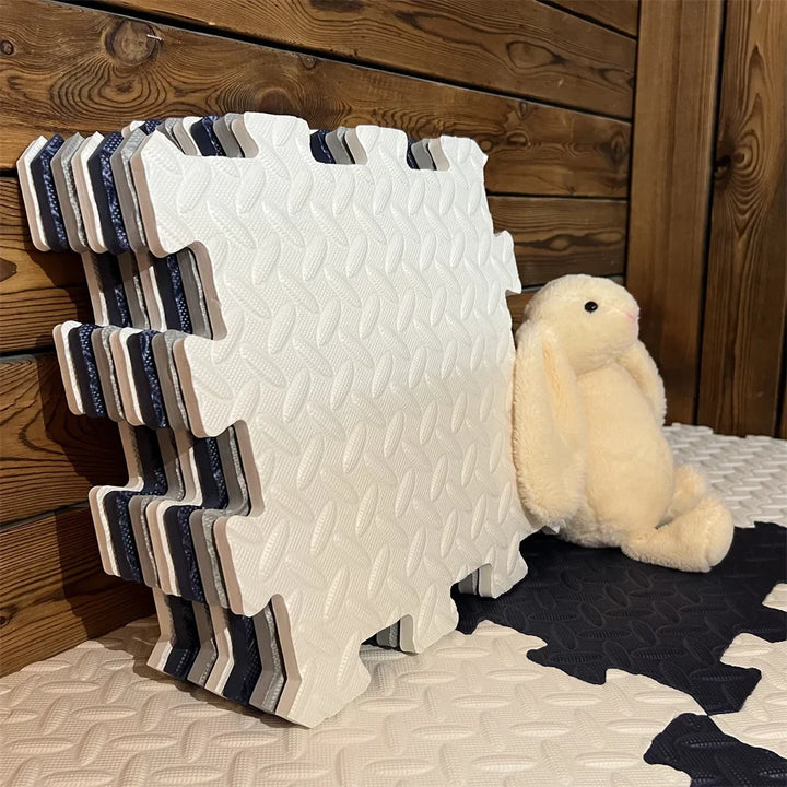 Tapis de jeu bébé modulable, sol souple pour aire de jeu sécurisée, parfait pour l'éveil enfant.