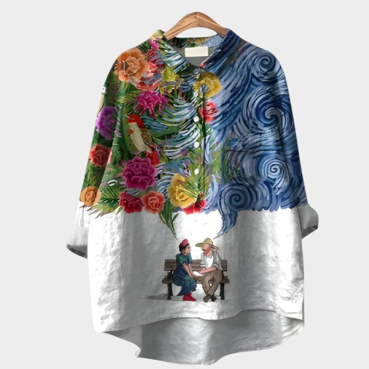 Blouse femme Nola fleurie avec manches longues et boutons, motif nature, style printemps/été élégant.