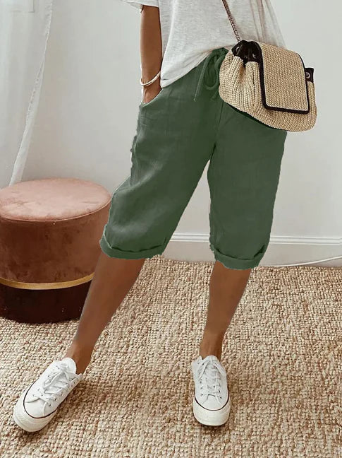 Pantalon fluide taille haute pour femme, confortable et léger, un essentiel chic et décontracté pour l'été.