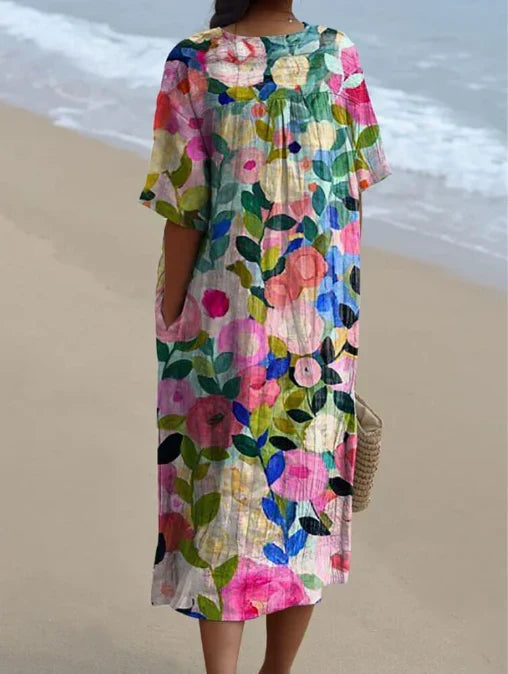 Robe florale d'été pour femme, design léger, parfaite pour la plage ou sorties printemps.
