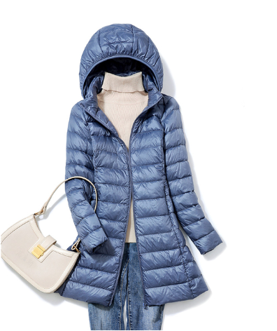 Manteau léger en duvet pour femme, compressible et chaud, parfait pour les voyages.