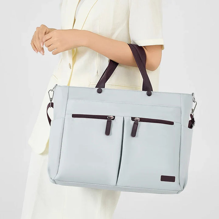 Sac de cours femme en toile canvas résistante, imperméable et léger, parfait pour une utilisation quotidienne.