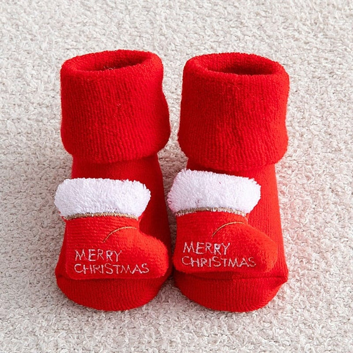 Semelle antidérapante de chaussons bébé de Noël, offrant adhérence et sécurité aux tout-petits.