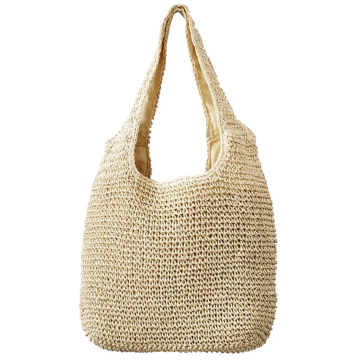 Sac cabas de plage Atria en paille, spacieux et chic pour transporter toutes vos affaires d'été.