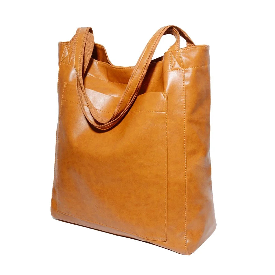 Sac fourre-tout femme en simili cuir souple. Grand cabas polyvalent pour travail, shopping ou sortie.