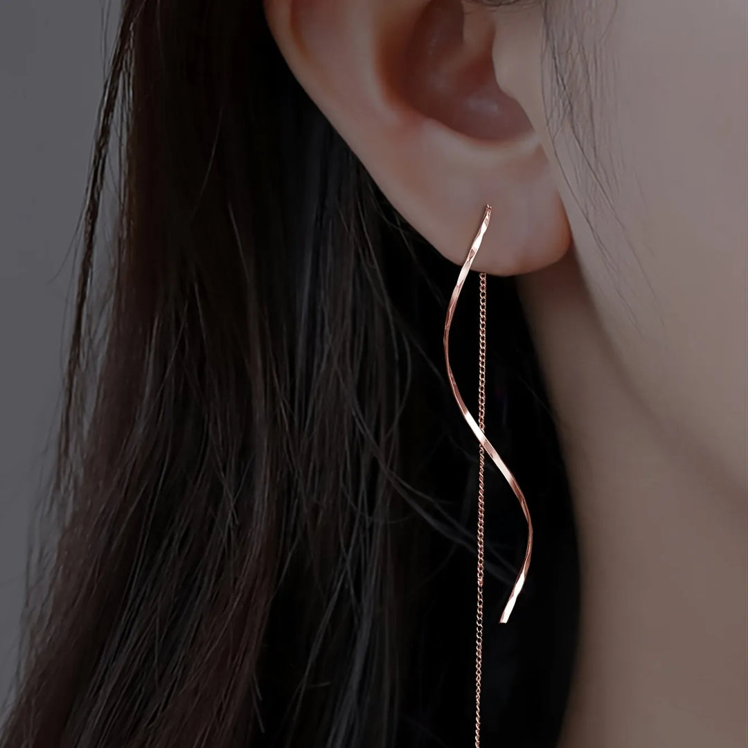 Paire de boucles d'oreilles vagues géométriques, longues et pendantes, finition or rose.