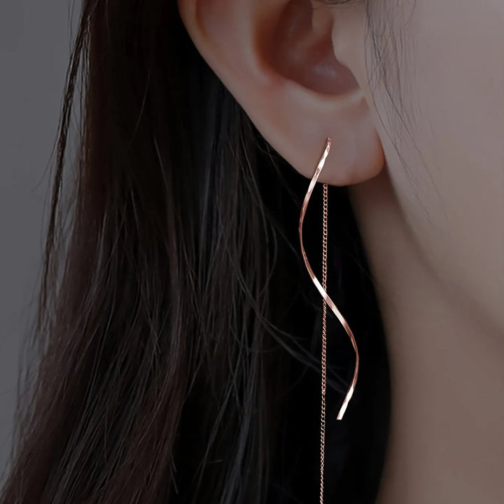 Paire de boucles d'oreilles vagues géométriques, longues et pendantes, finition or rose.