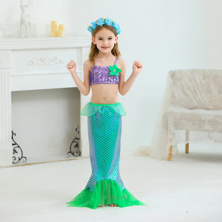 Déguisement enfant sirène bleu, vert et violet avec détails écailles, idéal pour fête d'anniversaire ou cosplay.