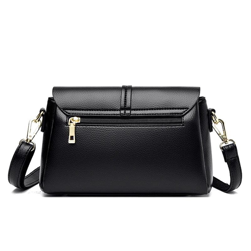 Fermoir doré élégant du sac besace femme noir en cuir PU. Détail chic pour un sac à main mode.