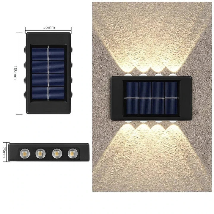 Ambiance nocturne avec une applique murale solaire LED bidirectionnelle, créant un éclairage élégant pour l'extérieur.