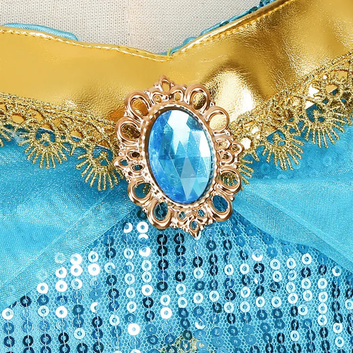 Pantalon sarouel bouffant du costume Princesse Jasmine fille. Pantalon ample bleu turquoise avec ornements dorés pour un look oriental.