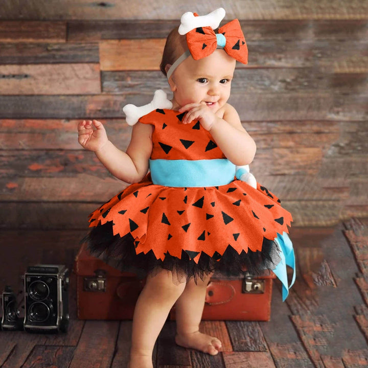 Déguisement Pierrafeu bébé fille. Robe verte et orange. Idéal carnaval, fête d'anniversaire préhistorique.