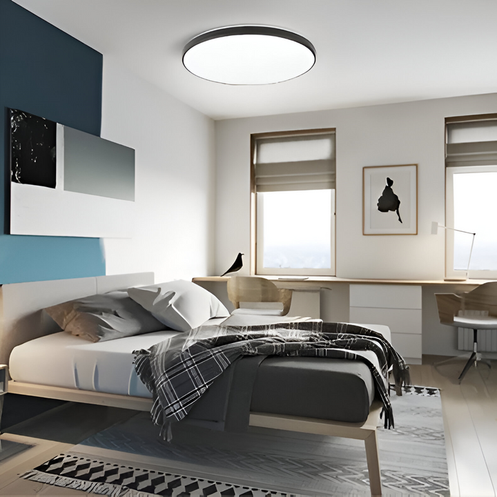 Plafonnier LED rond ultra fin moderne, éclairage design pour salon ou chambre.