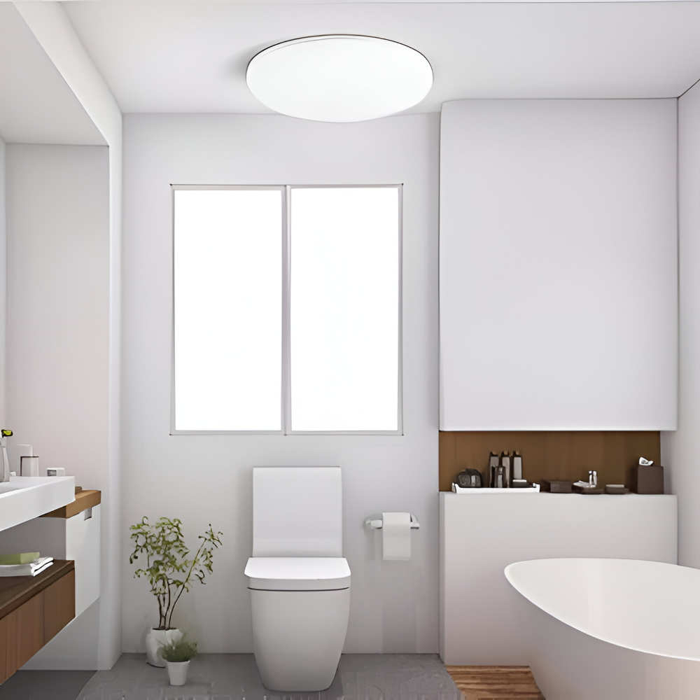 Plafonnier LED moderne, forme ronde et ultra fine, parfait pour un éclairage discret.