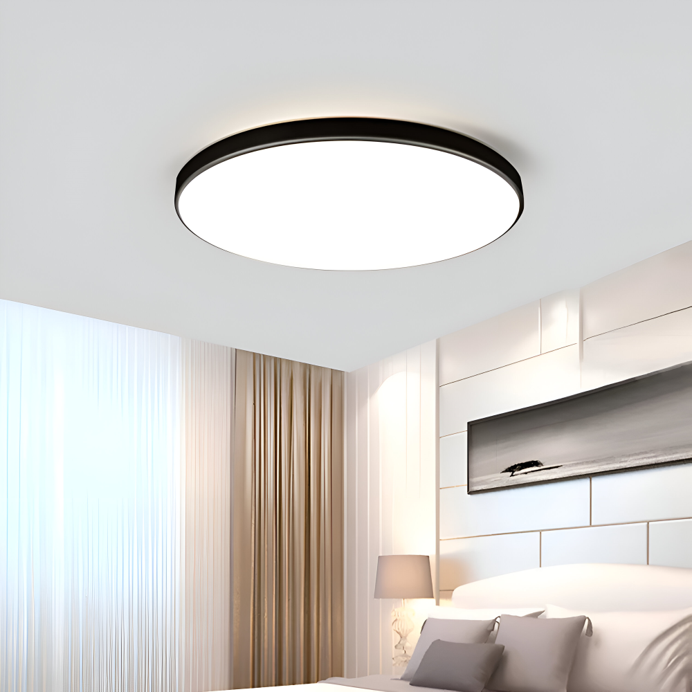 Plafonnier LED rond blanc, ultra fin, apporte modernité et lumière à votre maison.