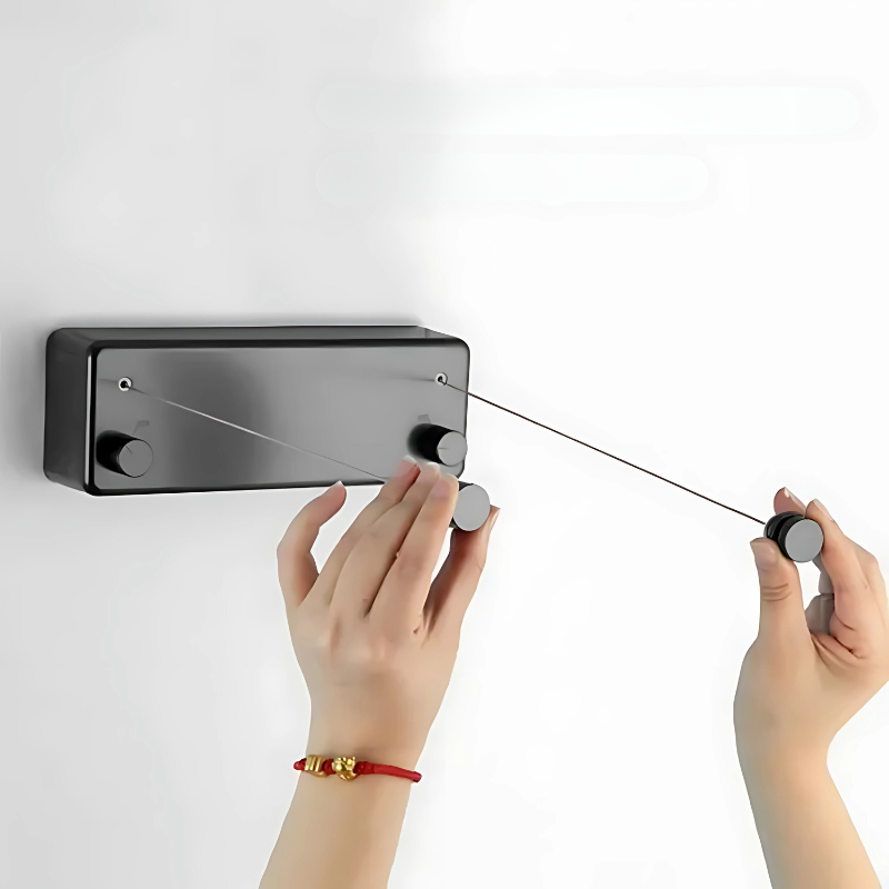 Fil à linge rétractable en inox SmartLine, parfait pour le séchage du linge dans les appartements ou maisons.